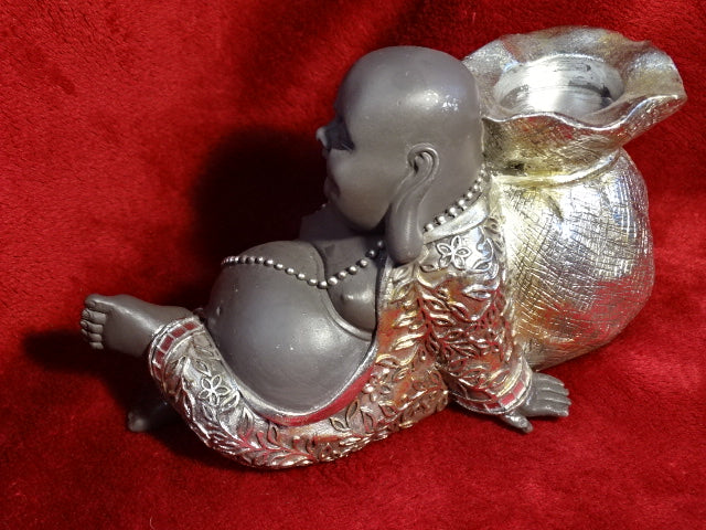 Reclining buddha tea-light holder