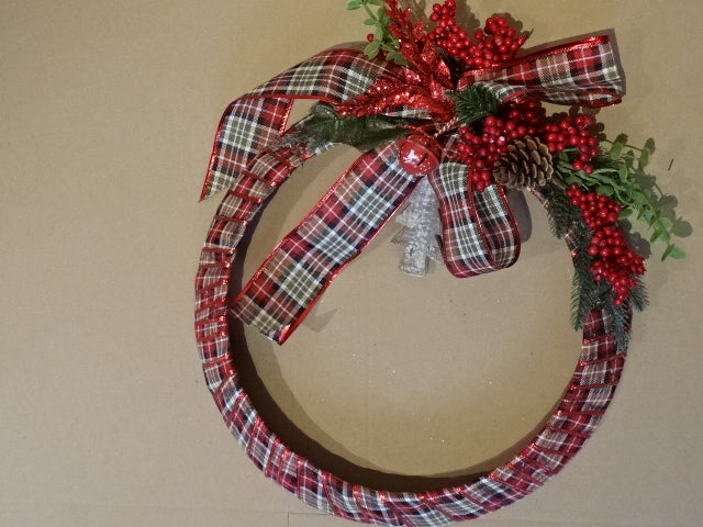 Handmade Christmas wreath with pine cones and bells